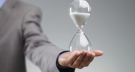 businessman_holding_hourglass___web 2